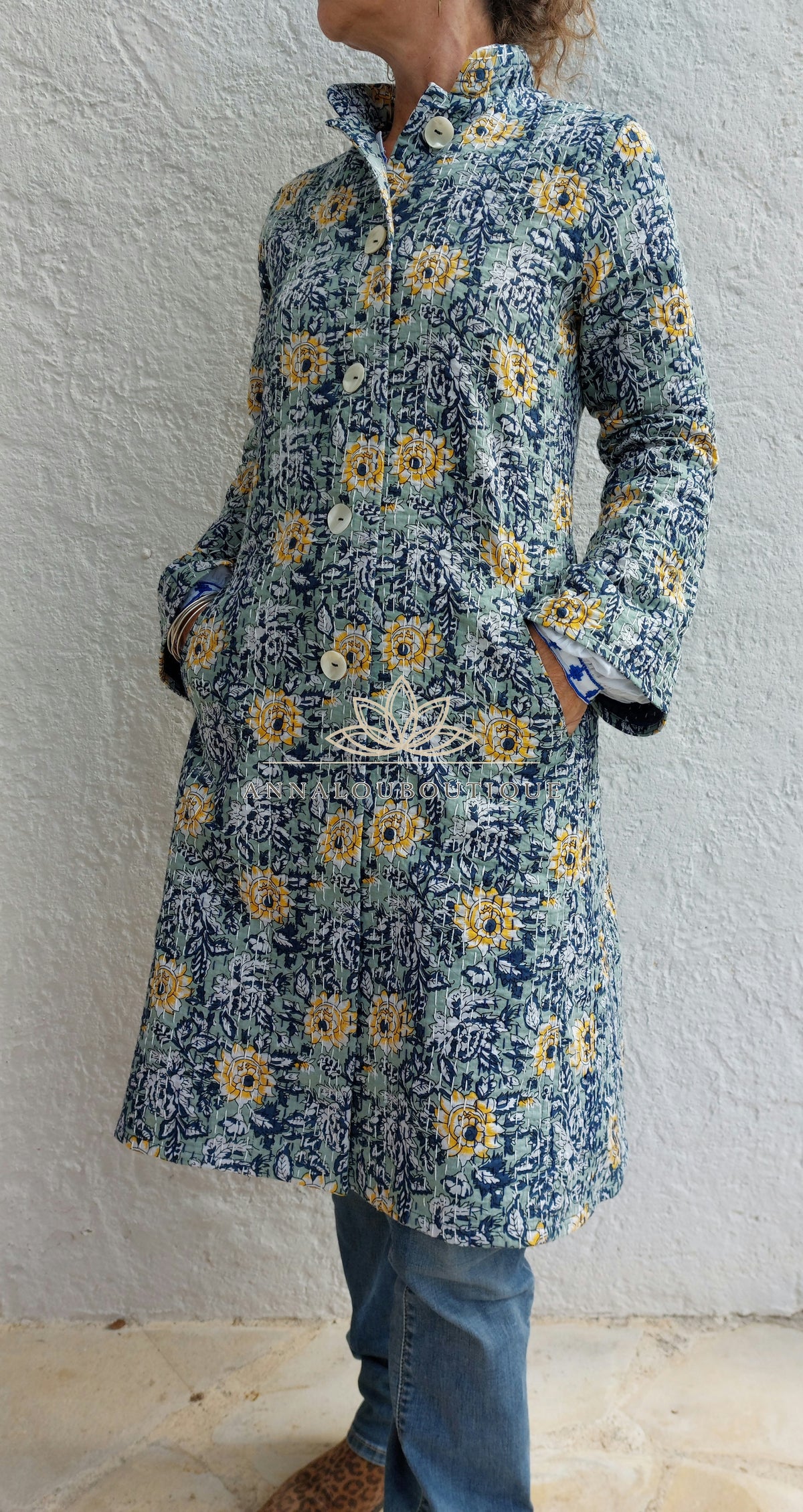 Embroidered navy and green frock coat
