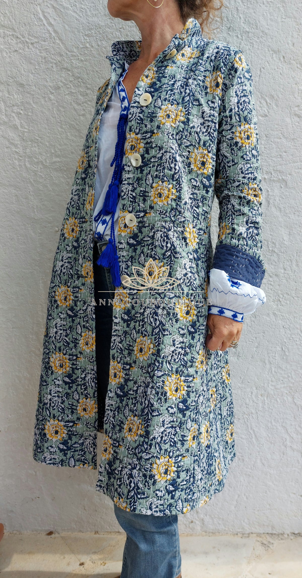 Embroidered navy and green frock coat