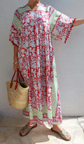 oversize dress in soft cotton, exclusive design, red pompons lace on sleeves, floral red pattern, green border, side pockets