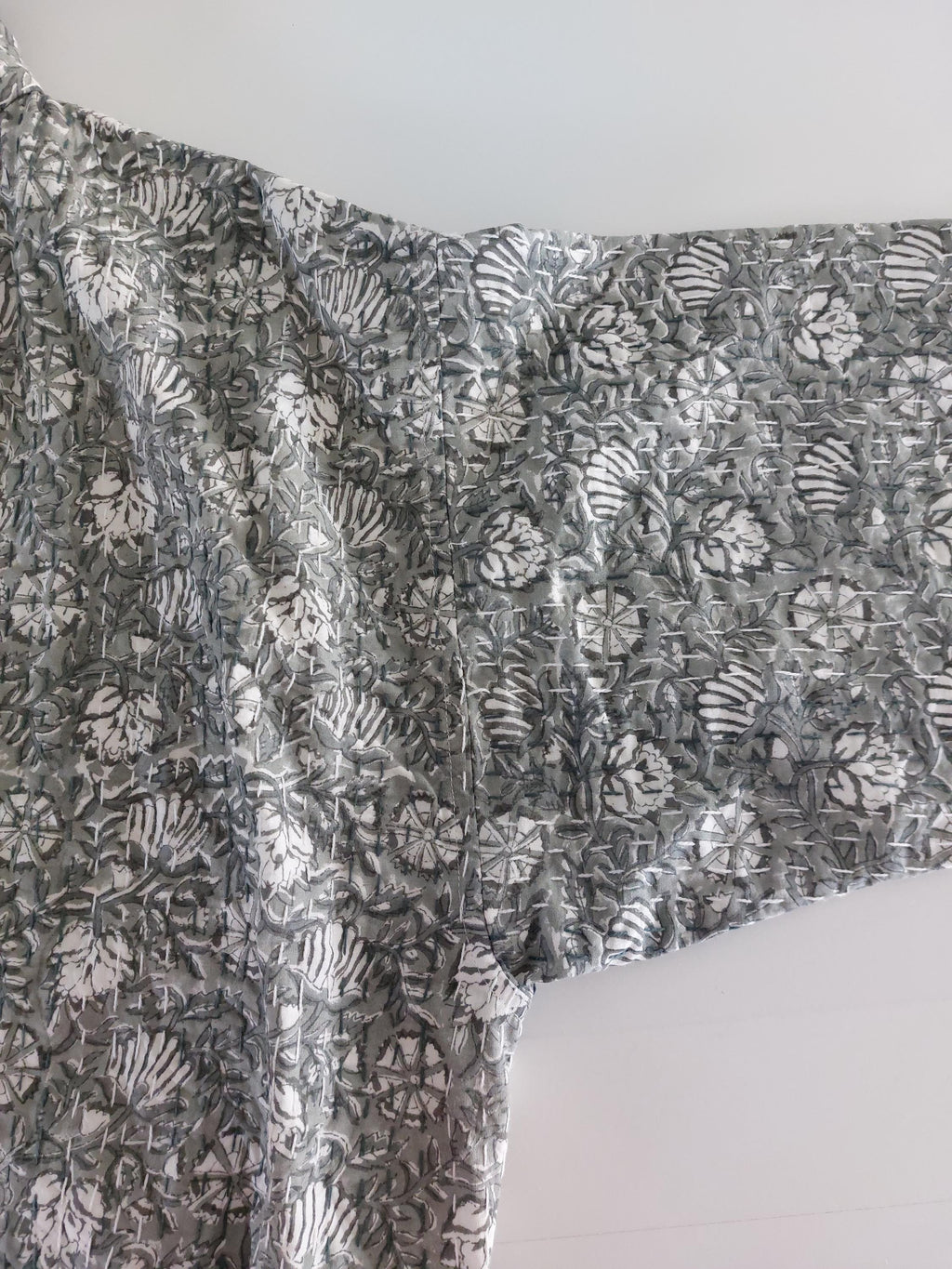 long oversize jacket,unique original design,in hand block printed color,in the shades of grey,floral print,large collar,large sleeves.
