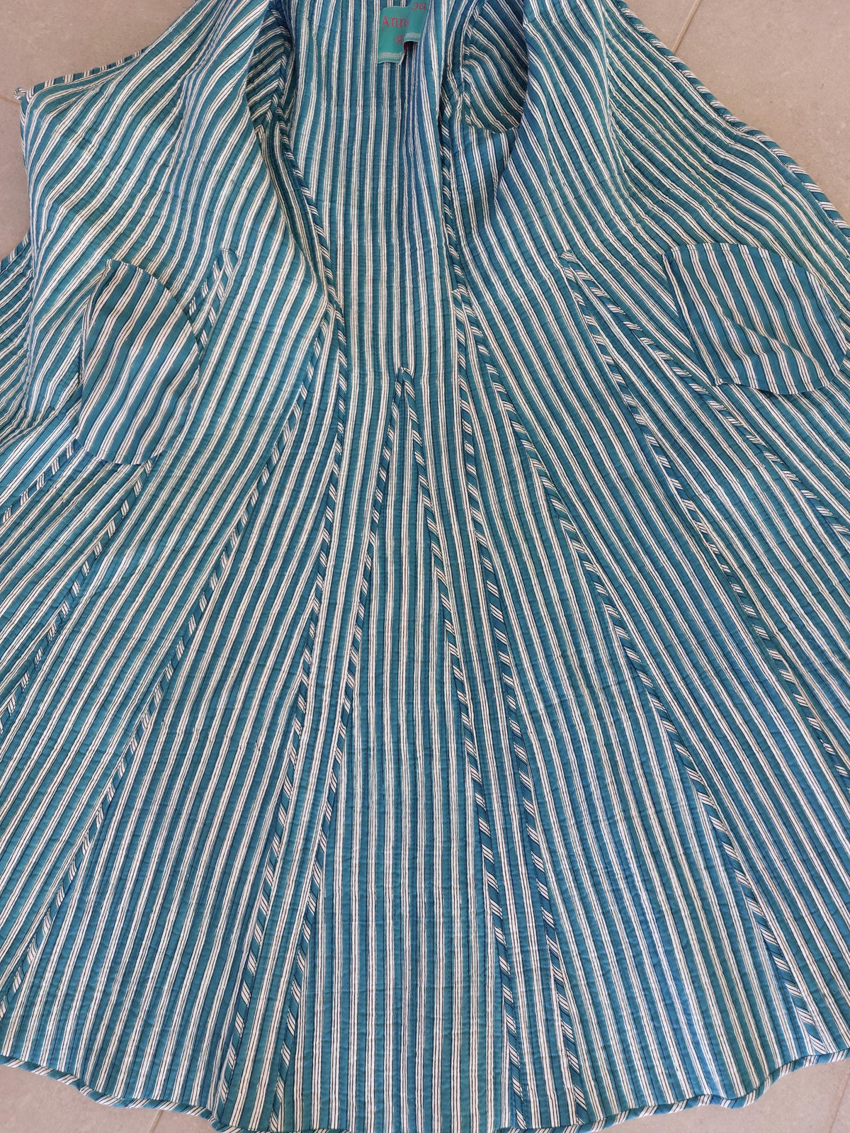 Quilted hydrangea coat with turquoise lining
