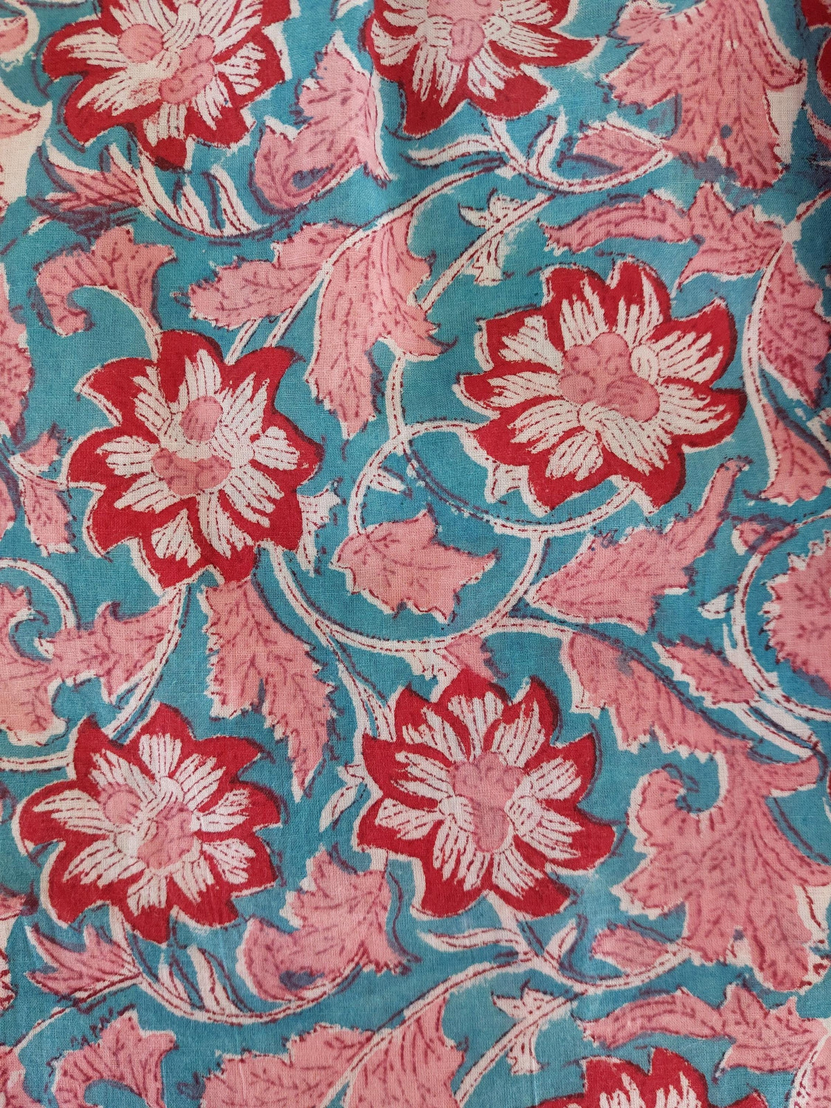 pleat long dress in hand block printed cotton,floral pattern in the shades of pink,red and blue,casual summer outfit