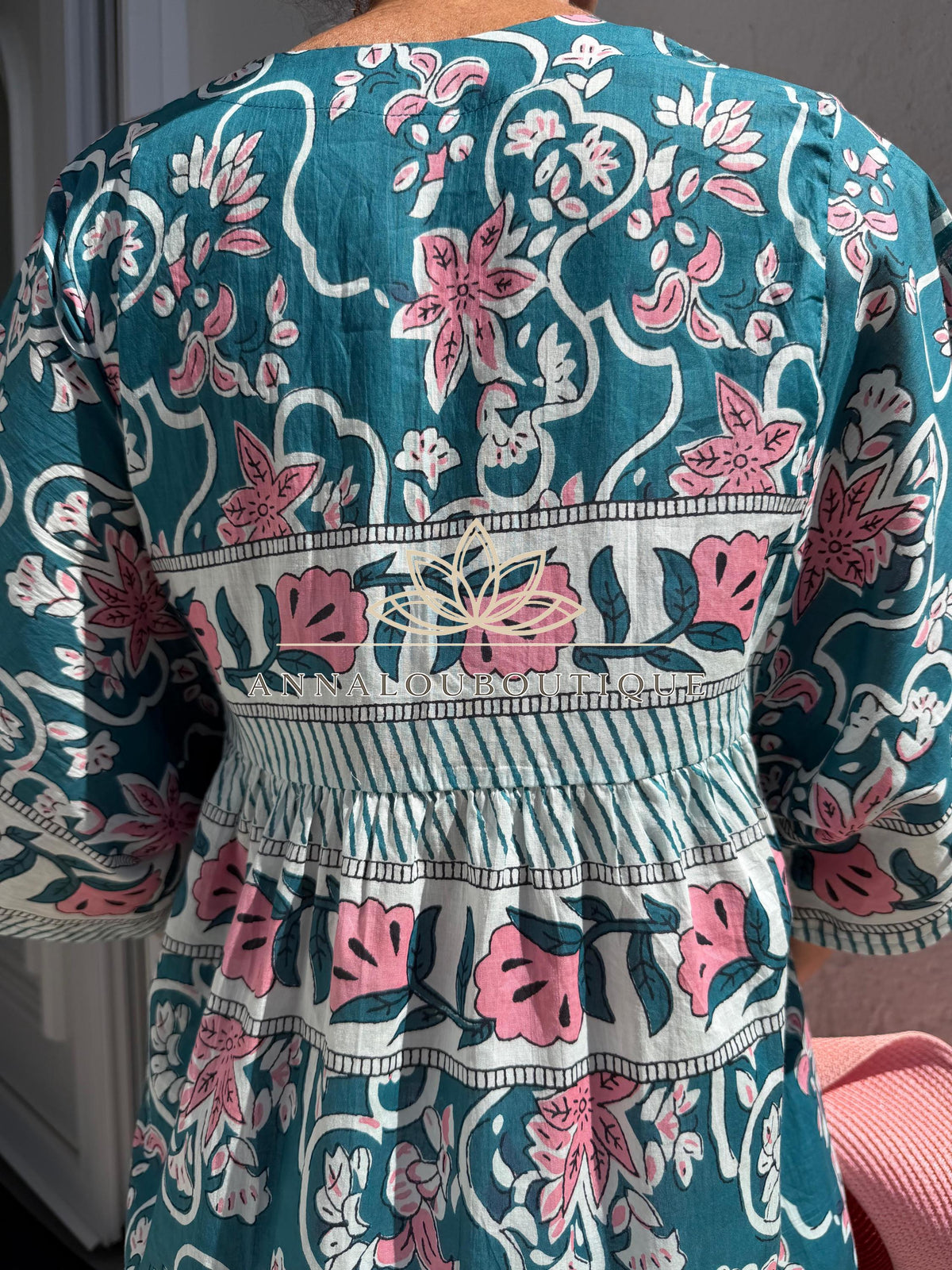 Loose teal dress with pink flowers