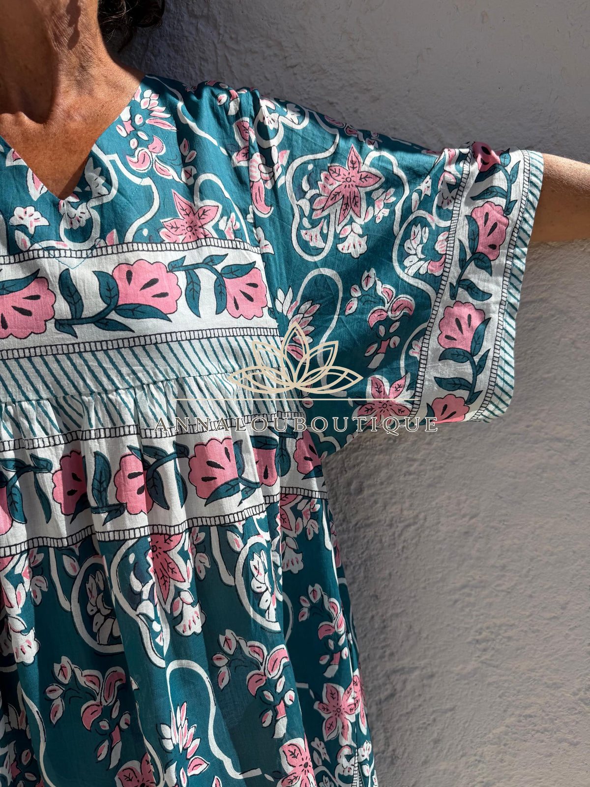 Loose teal dress with pink flowers