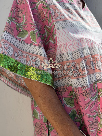 Loose pink and green dress with sequin sleeves