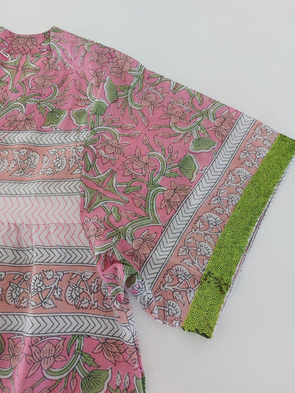 Loose pink and green dress with sequin sleeves