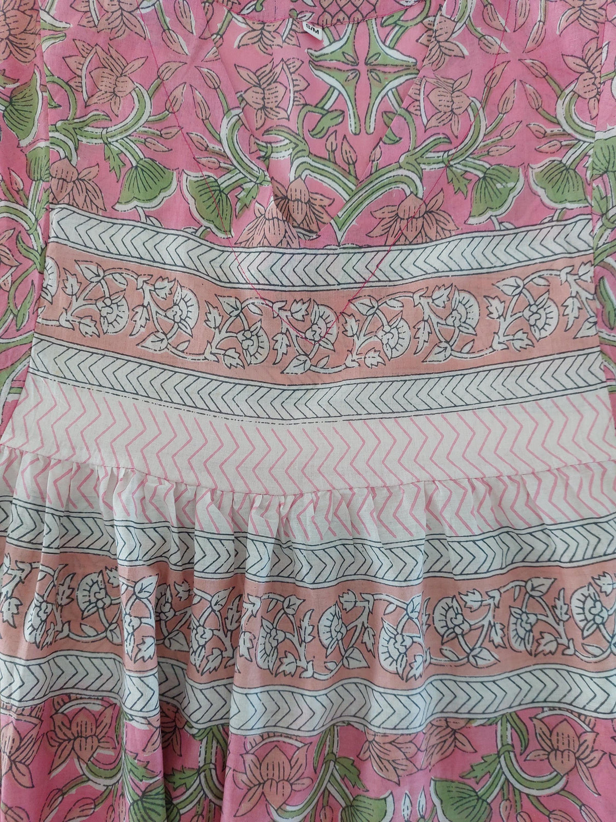 Fabric and finishing details: Loose pink and green dress with sequin sleeves