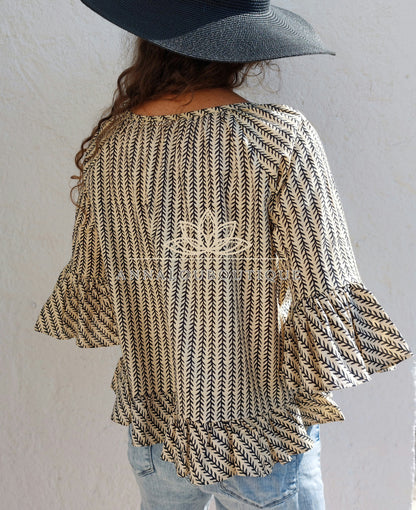 Blouse en coton noir et beige à volants